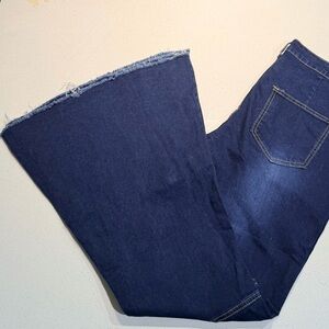 Barely worn dark wash high rise bell bottoms w/ no front pockets and raw hem, XL